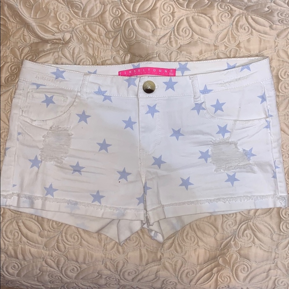 White jean shorts with blue stars